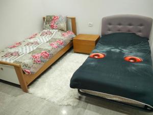 a bedroom with a bed with a face painted on it at Résidence Rahma in Hammam Chott