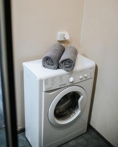 a washing machine with towels on top of it at Feels like home just 10 mins from the centre in Tallinn