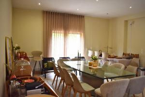 a dining room with a table and chairs at Casa da Aldeia in Penafiel