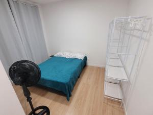 a bedroom with a bunk bed and a ladder at Lugar tranquilo in Biguaçu +14 photos