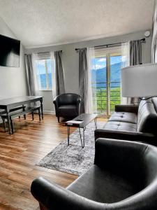 a living room with a couch and a table at Spacious Gatlinburg Condo With Million Dollar Mountain Views in Gatlinburg