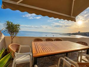 a table and chairs with a view of the ocean at Owen Rooftop in Shëngjin