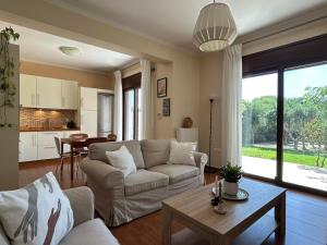 a living room with a couch and a table at Rhodes Soul Luxury Home in Asgourou +81 photos