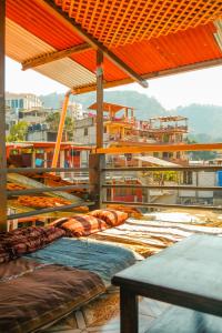 a group of beds sitting on top of a building at Mandala’s Hostal in San Pedro La Laguna