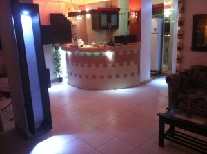 a kitchen with a island in the middle of a room at Chery Private Suite in Marsa Alam City