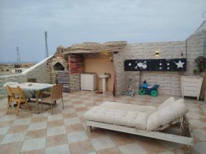 a living room with a couch and a table at Chery Private Suite in Marsa Alam City