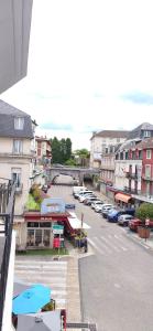 an aerial view of a city with a parking lot at Hôtel Duchesse Anne in Lourdes