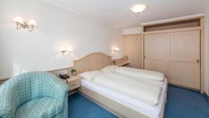 Ένα ή περισσότερα κρεβάτια σε δωμάτιο στο Appartements Buggl's