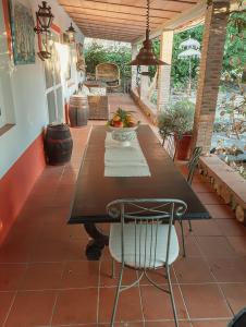 a table and chairs on a patio with a table at Monte do Rei Santo in Arronches