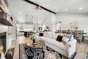 a living room with a couch and a table at Four Sisters Cottage- Walk to Sister Bay, Fireplace, Ping Pong & More in Sister Bay +50 photos