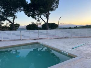 a swimming pool in a backyard with a fence at B&B Villa Elianto in Notaresco +12 photos