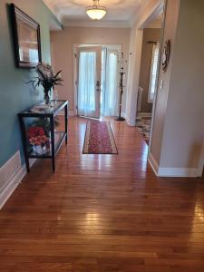 an empty living room with a hard wood floor at Blessings Private Home in Louisville +11 photos