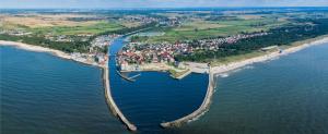 an aerial view of a bridge over a body of water at Villa Alexandria in Darłówko