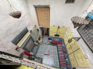 an overhead view of a patio with a swimming pool at Hostel Dar Caftan in Fez +39 photos