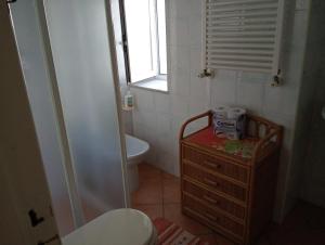 a bathroom with a toilet and a sink at CASA Pitosforo CASA Ulivo in Forio d'Ischia +58 photos