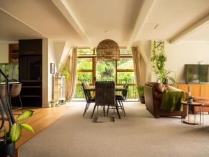 a living room with a couch and a table at Moana View in Paihia
