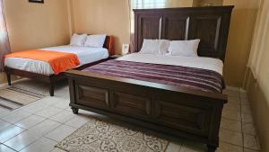 a couple of beds in a room at Smithy's Apartment 1 in Brighton Village