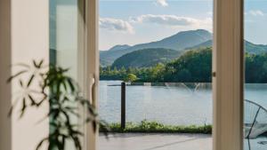 a view of a lake from a door at Chuncheon Rehouse in Chuncheon