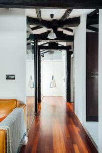 a living room with a wooden floor and a large window at GOZATEGI - Photo studio in Irún