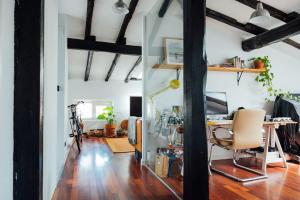 an open living room with a desk and a table at GOZATEGI - Photo studio in Irún