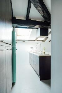 a kitchen with a sink and a counter top at GOZATEGI - Photo studio in Irún +8 photos