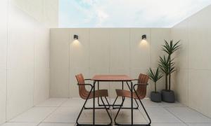 a dining room with a table and chairs at Brown Dot Hotel Andong Taehwa in Andong