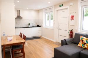 a living room with a couch and a table at Malladoura Passive House in Porriño