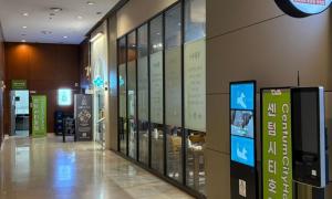 a hallway of a building with a display of books at Centum City Hotel in Busan +58 photos