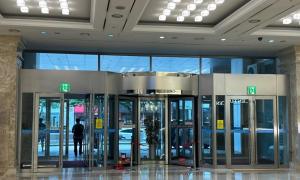 a lobby with several revolving doors in a building at Centum City Hotel in Busan