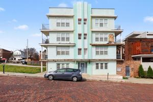 a car parked in front of a building at Downtown Omaha - Elevated Studio & 1-Bed Stays in Omaha