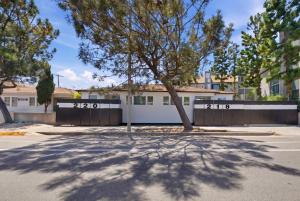a building with a tree in front of a street at Venice Venice in Los Angeles