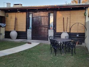 a table and chairs in front of a building at Namasté in Villa Larca +12 photos