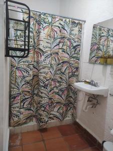 a bathroom with a shower and a sink at Rincón de la Luna in Tepoztlán +21 photos