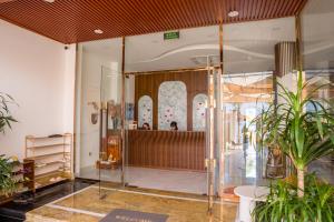 a lobby of a store with a glass door at Mia Beach Hotel in Cù Lao Thu