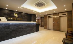 a lobby of a hotel with a sign that reads bevind hotel at Beyond Hotel in Incheon