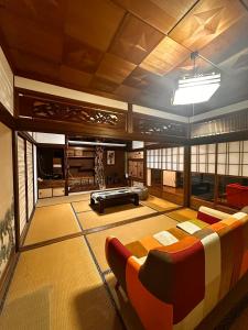a large living room with a couch and a table at IPPONMATSU Private Villa - 宮崎の古民家一棟貸し 一本松 in Miyazaki