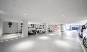 a garage with two cars parked in it at Brown Dot Hotel NamGumi in Yangji-mal