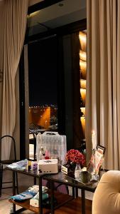 a living room with a table with a candle at Velora Suites in Abha