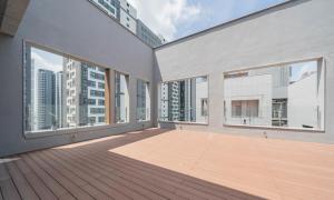 an empty room with large windows and a deck at The hound hotel bandalseom2 in Ansan