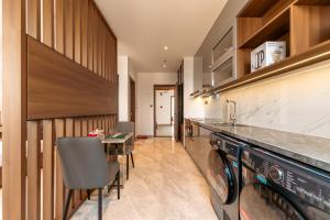 a laundry room with a washer and dryer at My Khe Hotel in Danang