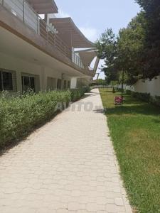 a brick walkway in front of a building at mona in Sidi Rahal