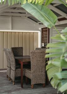 a wooden table and chairs in a room at Heritage Hideaway in Bunbury