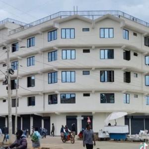 a large building with people standing in front of it at Rees haven in Nanyuki