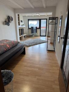 a large living room with a couch and a fireplace at Ferienhaus Seilerbahn 17 in Vallendar