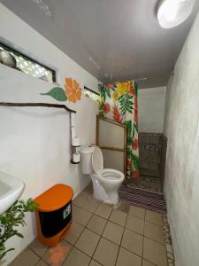 a bathroom with a toilet and a sink at Pension Mitiana in Tatoi