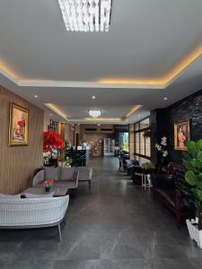 a lobby of a hotel with couches and chairs at The Room Boutique Hotel in Sakon Nakhon +88 photos