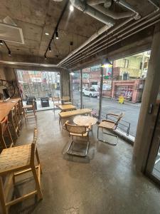 a room with tables and chairs and a street at Pohang Daejamdong Route 422 in Pohang
