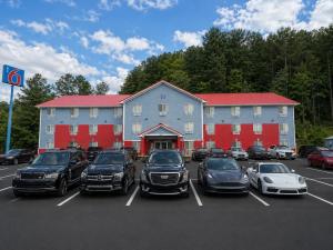 a large building with cars parked in a parking lot at Motel 6 Morehead, KY in Morehead