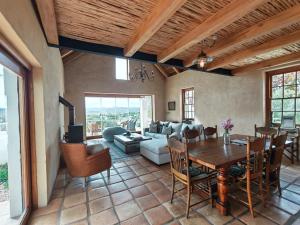 a living room with a table and a couch at Chalcedony in McGregor