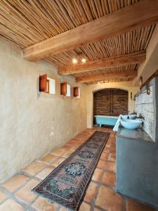 a bathroom with a sink and a rug on the floor at Chalcedony in McGregor